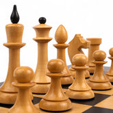Wooden chess pieces on a checkered chessboard